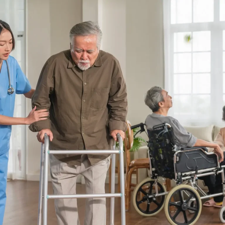 Support worker assisting old man