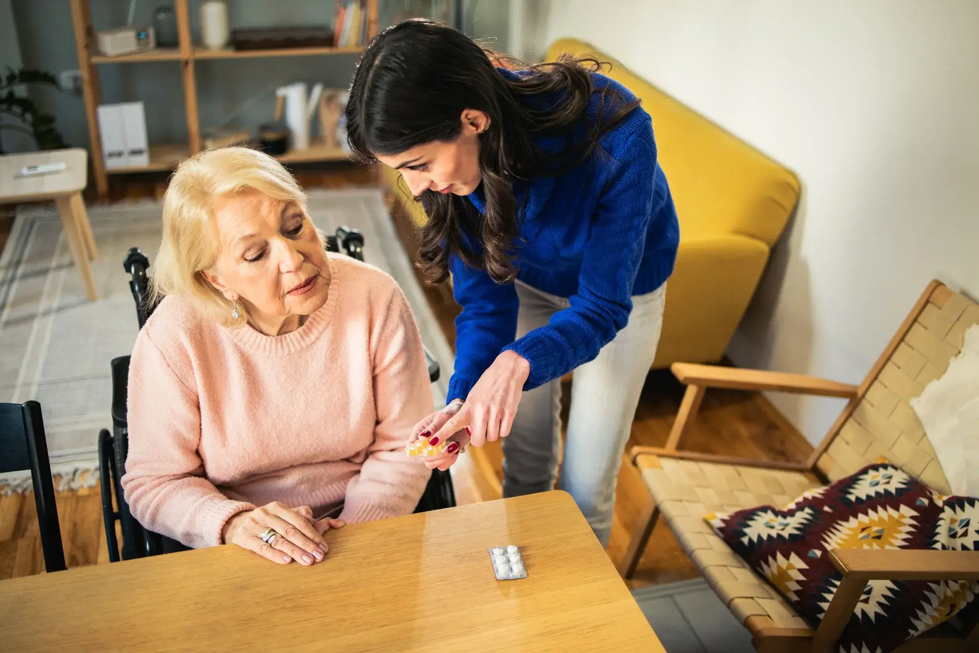 Support worker talking with elderly woman